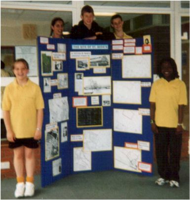 Some of the St Bede's pupils with their display in the school's main entrance.